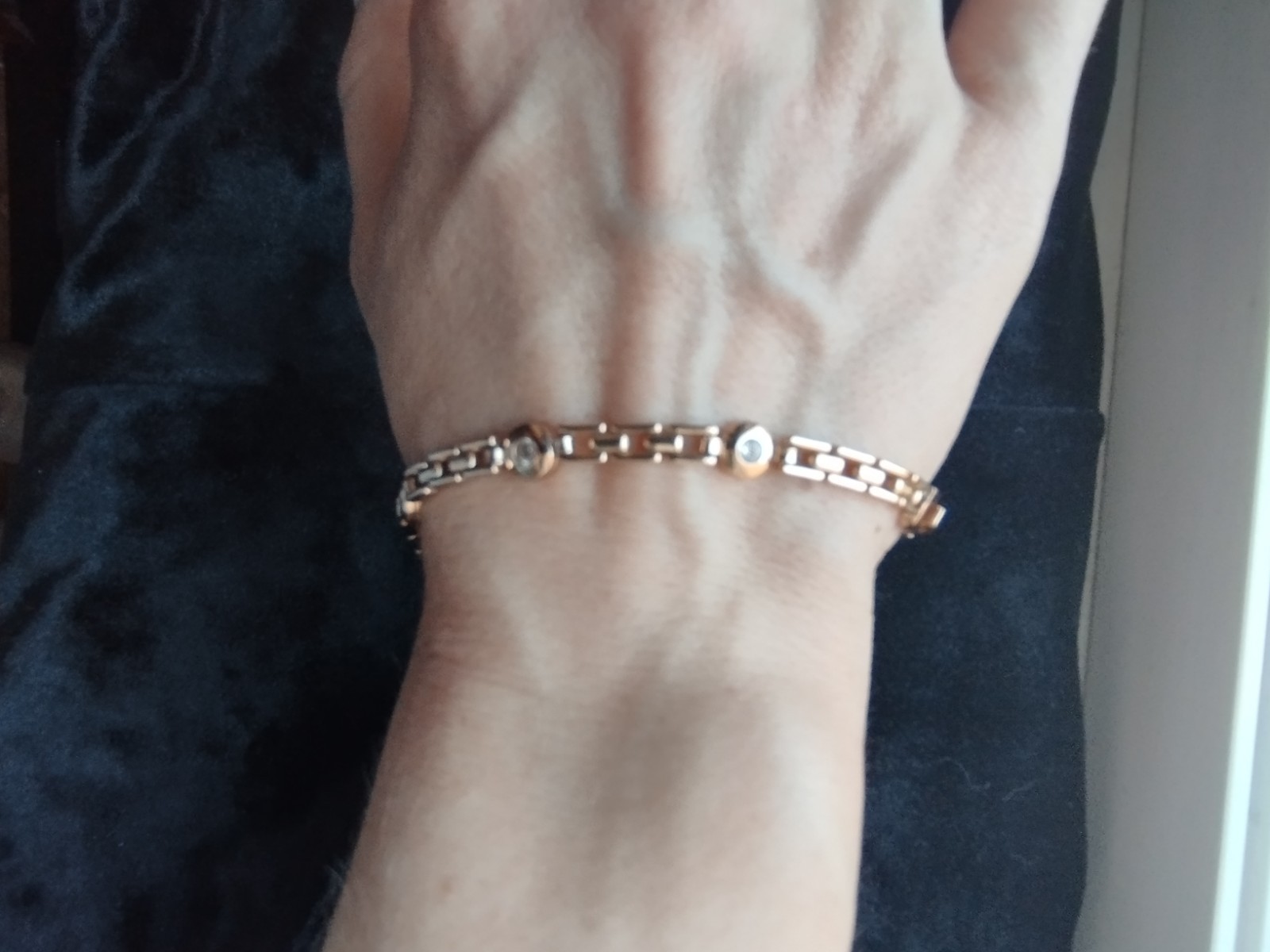 Gold-colored bracelet.