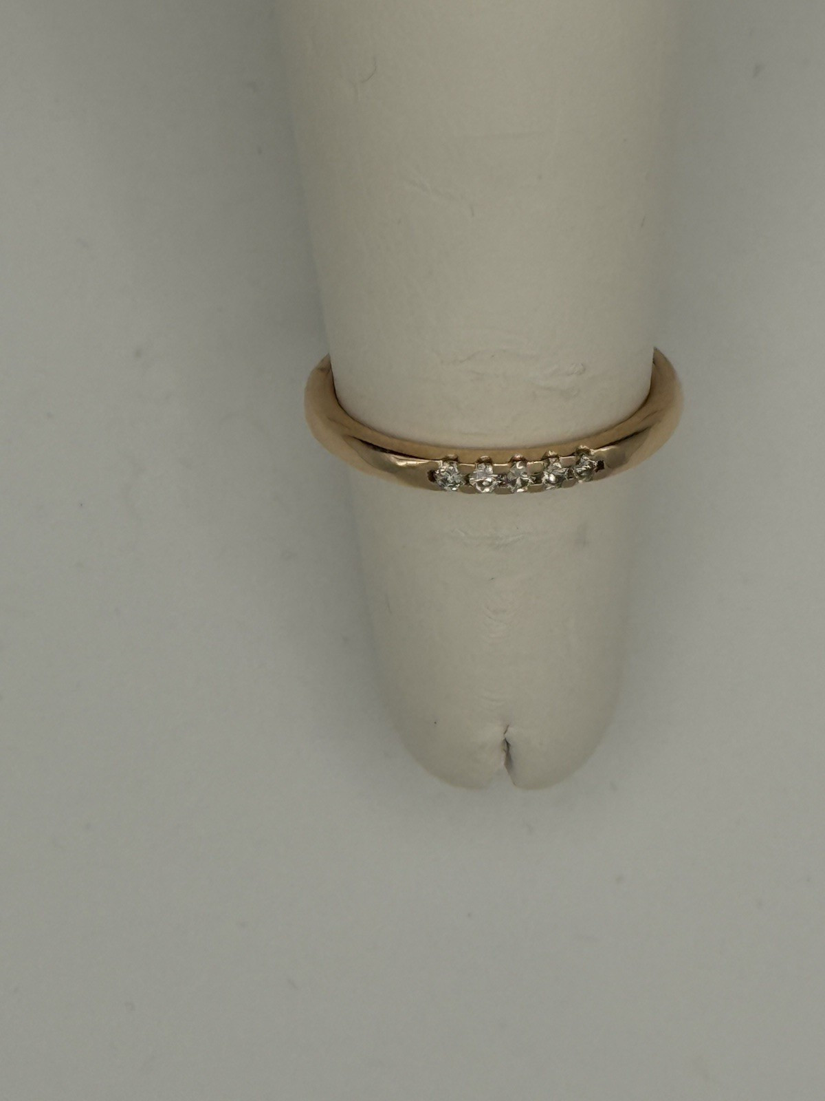 Brand new 14KT rose gold natural diamond ring. It has 2.5 grams & .11ct diamonds