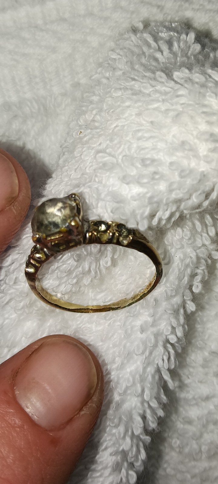 vintage 14k white gold engagement ring a central diamond and side accents.