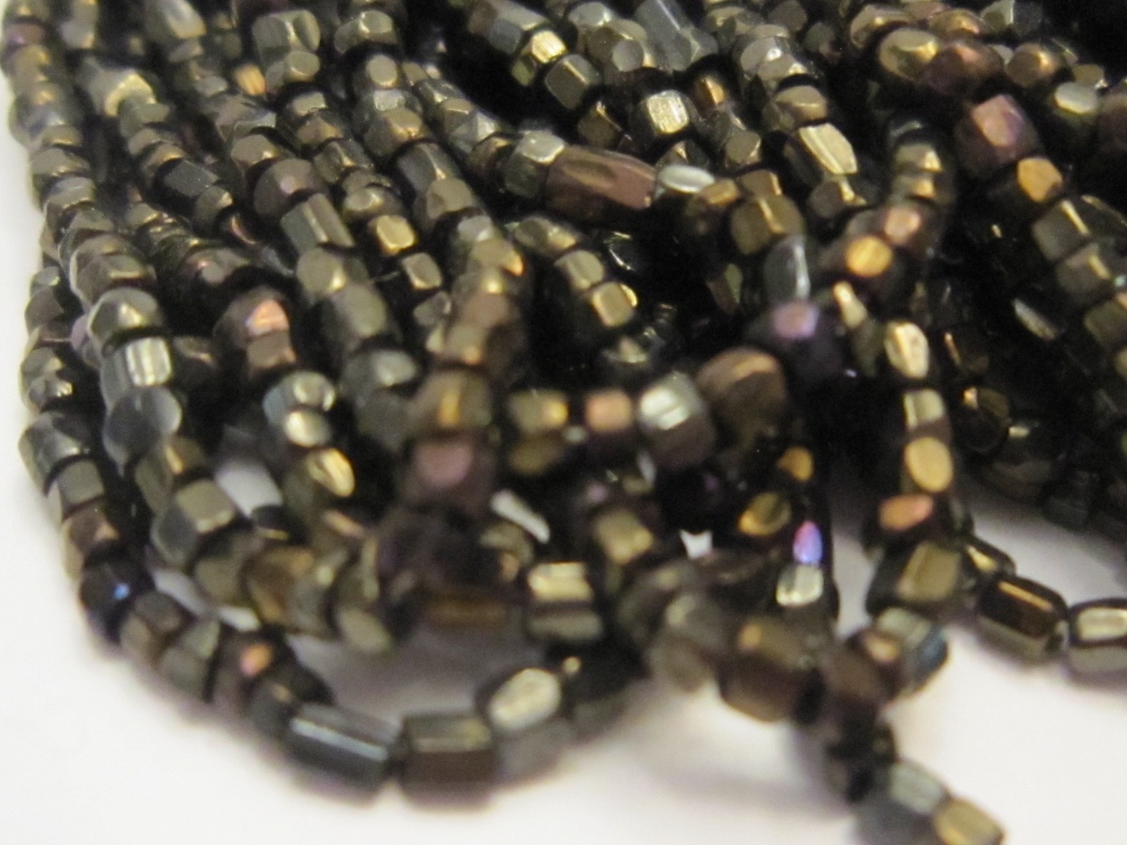 Hank Czech vintage dark topaz lustre faceted micro seed glass beads