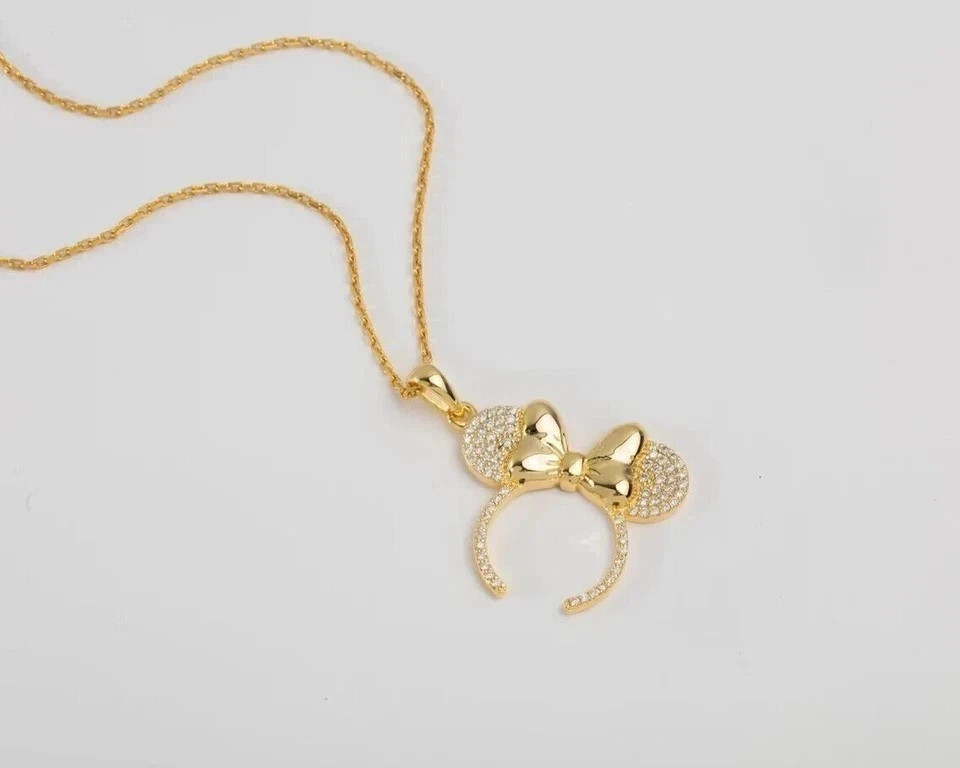 Sterling Silver Gold Finished -Tone Bow Pendant Necklace with Crystal Accents