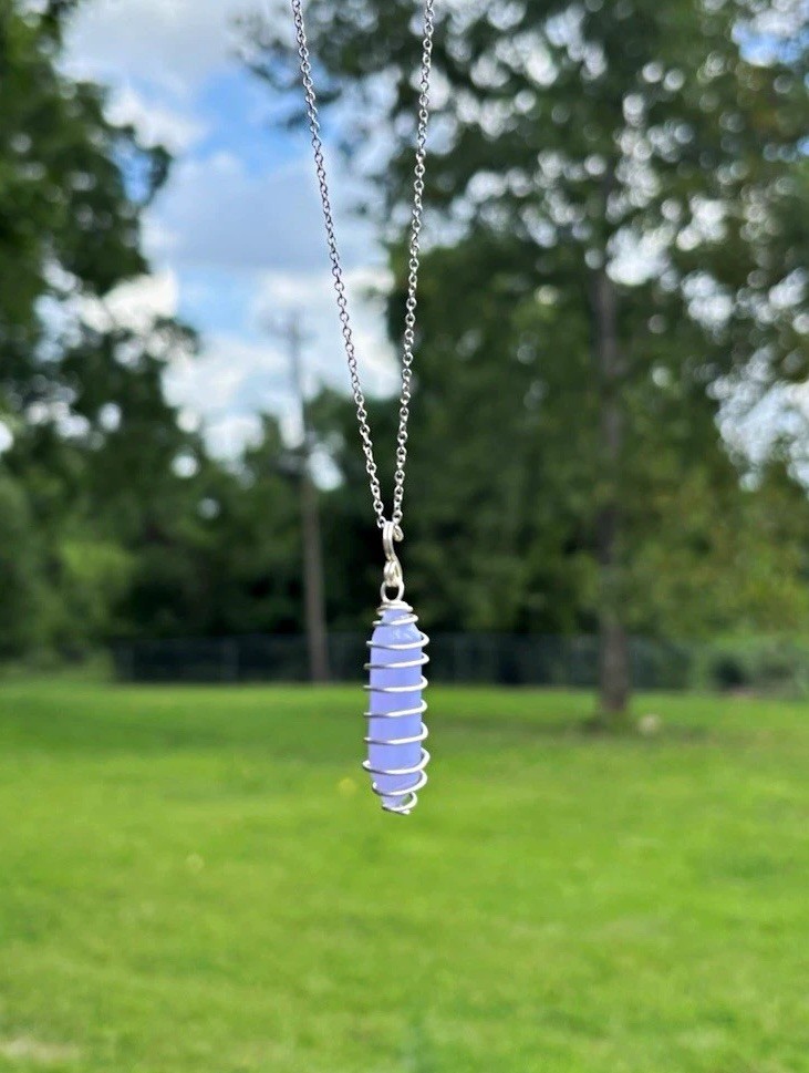spiral wire-wrapped crystal point pendant on a 16inch silver plated chain