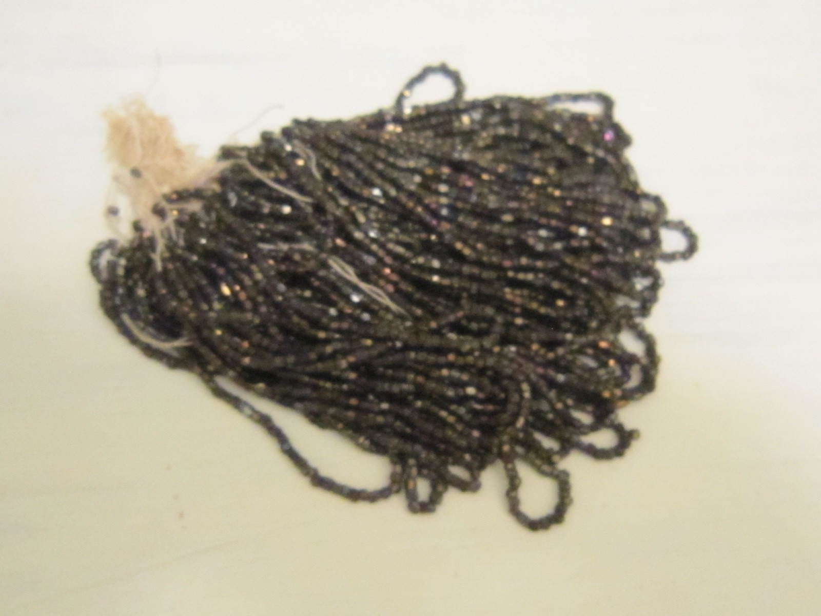 Hank Czech vintage dark topaz lustre faceted micro seed glass beads