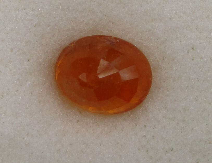 5.02 Carat, Yellow Orange Tangerine Garnet, 10 x 8 Oval, Very Slightly Included.