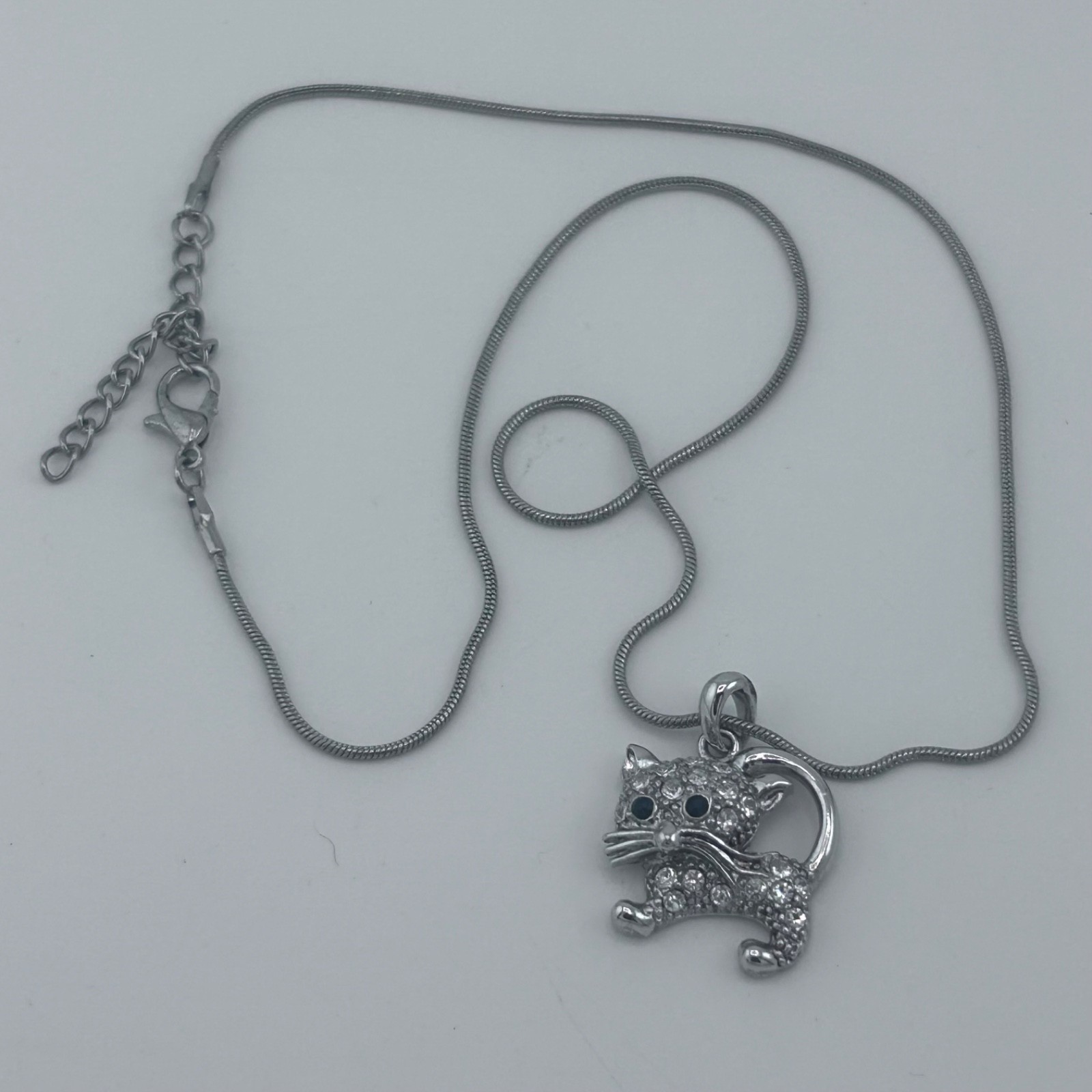 Silver toned Cat pave set with Clear Rhinestones and Dark Stone Eyes Snake Chain