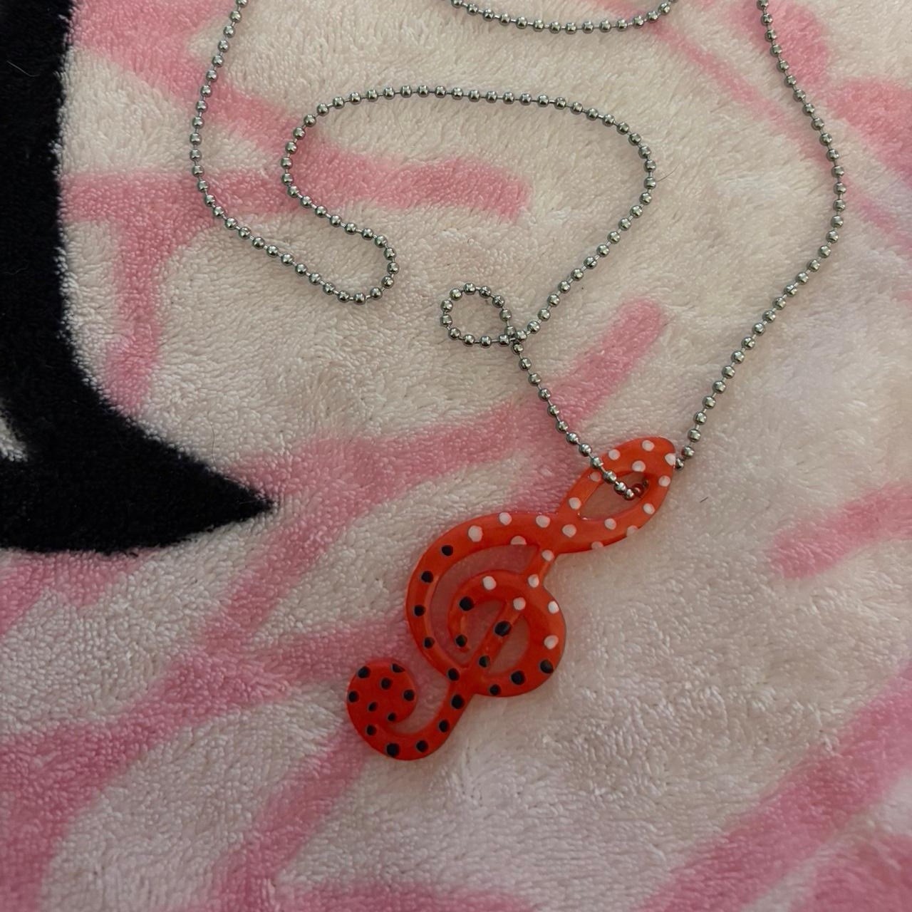 Handmade red treble clef charm necklace with black and white polkadots