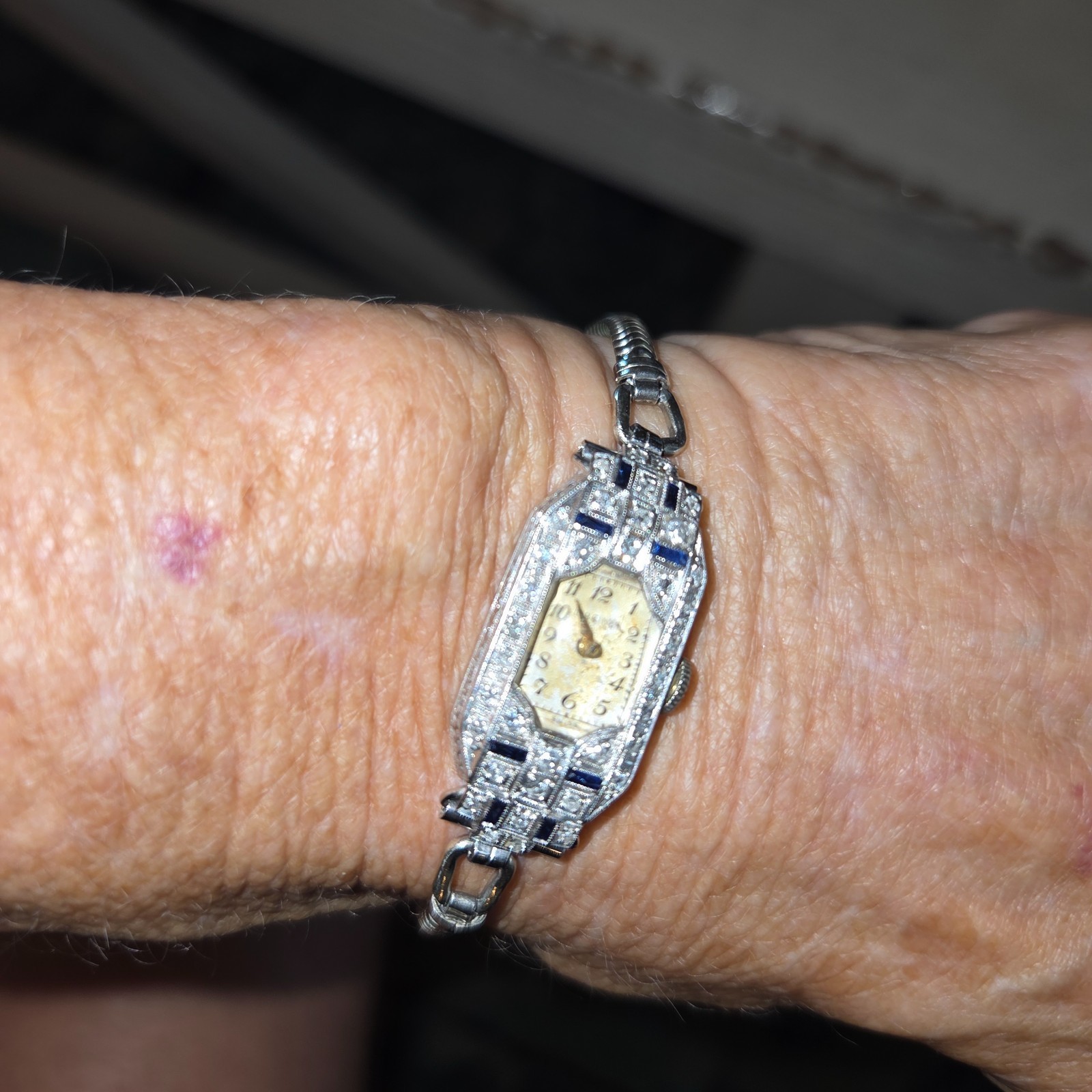 vintage watch, Art Deco style, tiny diamonds and small sapphire bars adorn the f