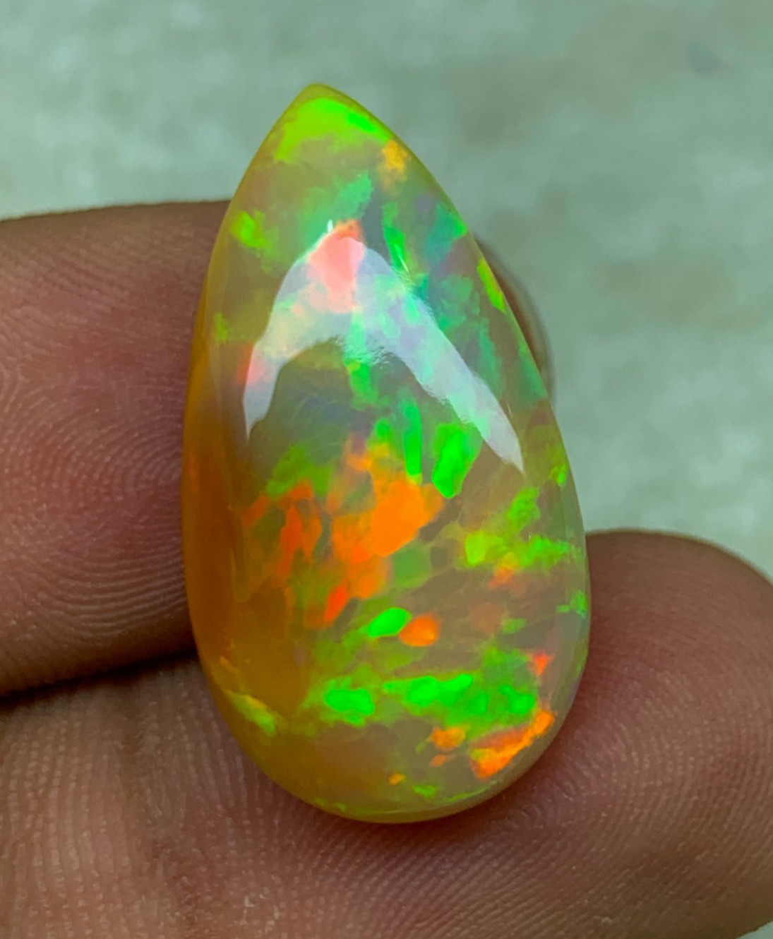 Natural Ethiopian Opal Honeycomb Pattern 14.90 Carat Multi-Fire Pear Cabochon