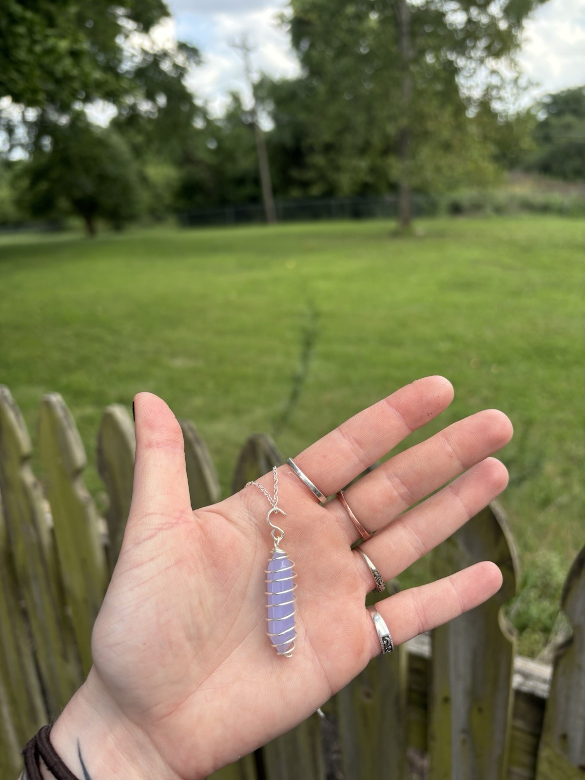spiral wire-wrapped crystal point pendant on a 16inch silver plated chain