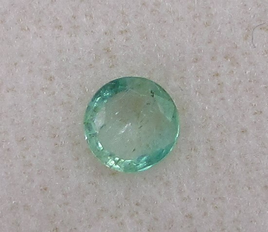 0.46 Carat Green Emerald, 5.6 mm Round, Very Slightly Included. COA