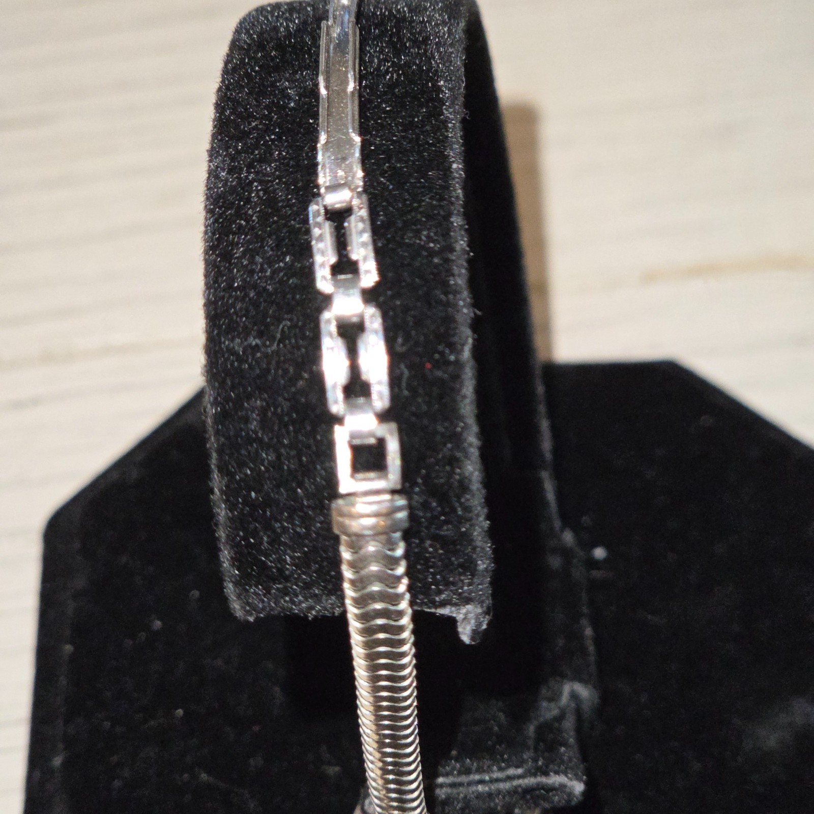vintage watch, Art Deco style, tiny diamonds and small sapphire bars adorn the f