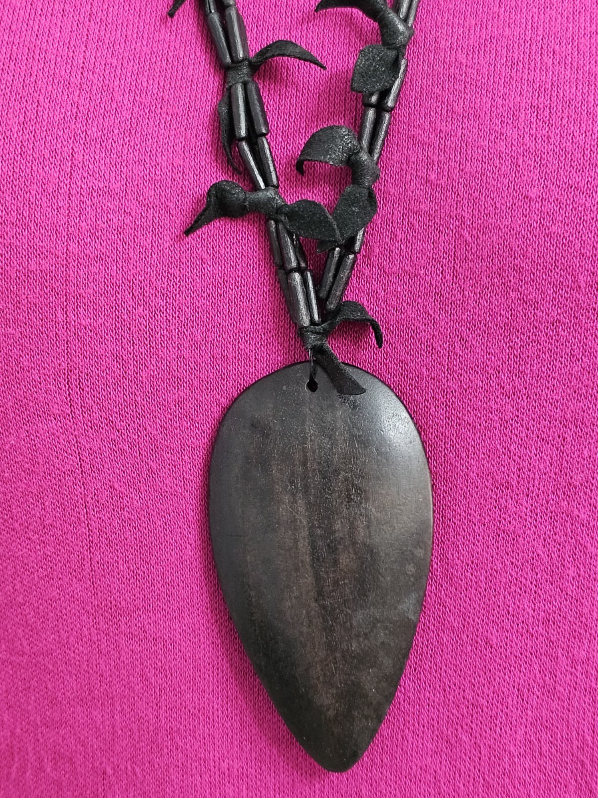 Rare long necklace wood and leather very light weight material. Monies maybe??
