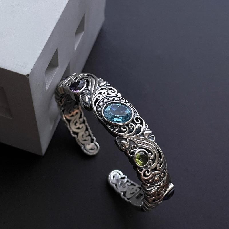 Openwork carved blue topaz bracelet for women, vintage style.