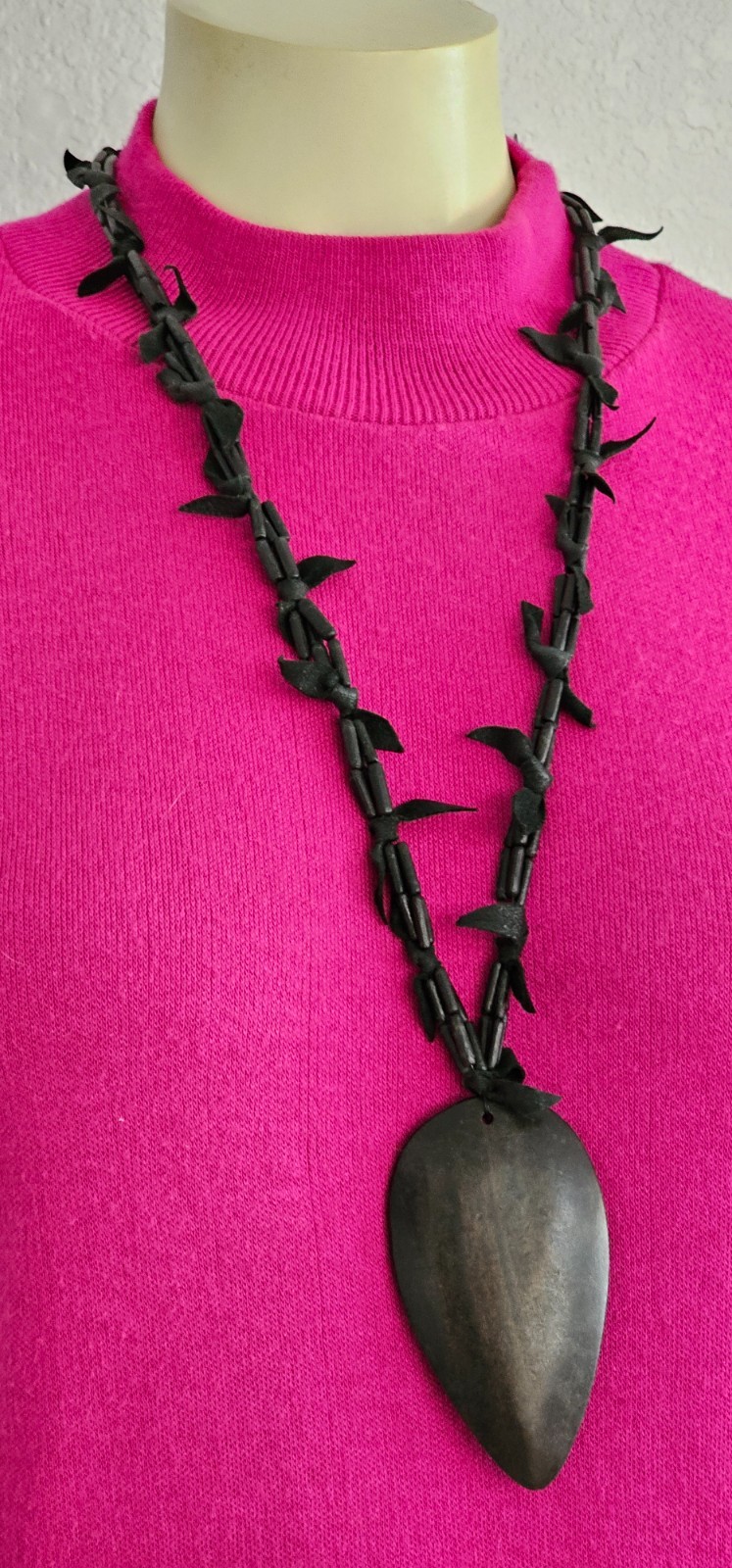 Rare long necklace wood and leather very light weight material. Monies maybe??