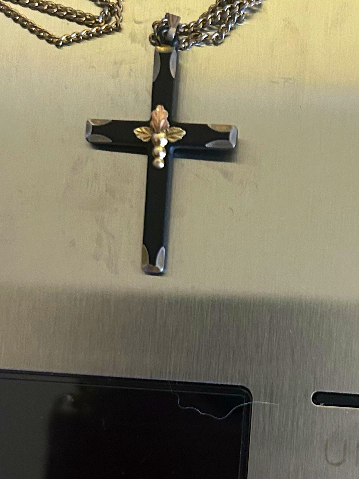Black Hills Gold cross necklace, featuring a black powder-coated cross 9in