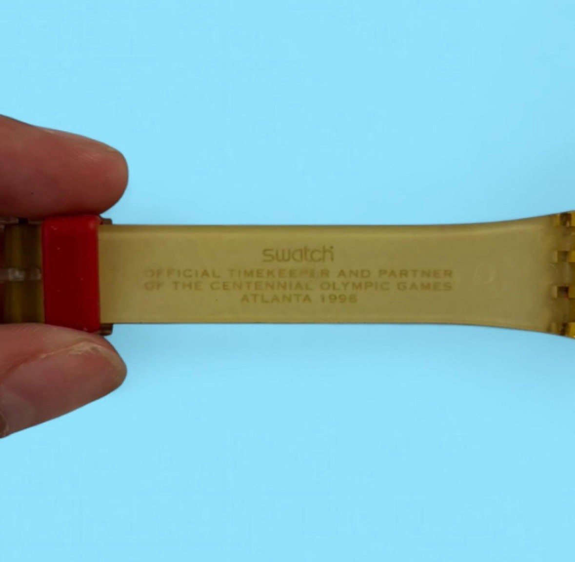 Swatch Moscow 1980 Olympics Quartz Analog Watch 25mm 30m Gold/Red Strap
