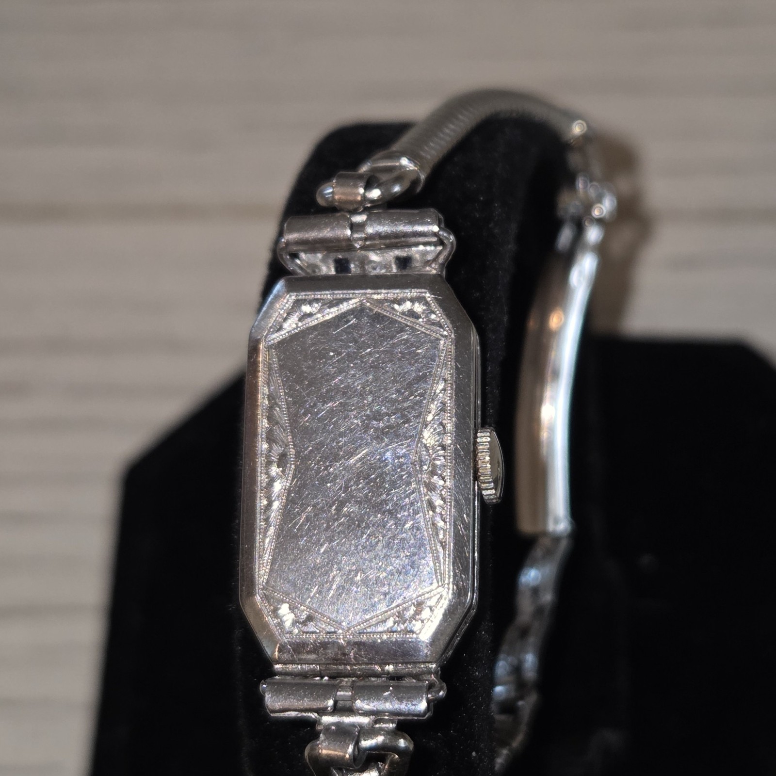 vintage watch, Art Deco style, tiny diamonds and small sapphire bars adorn the f