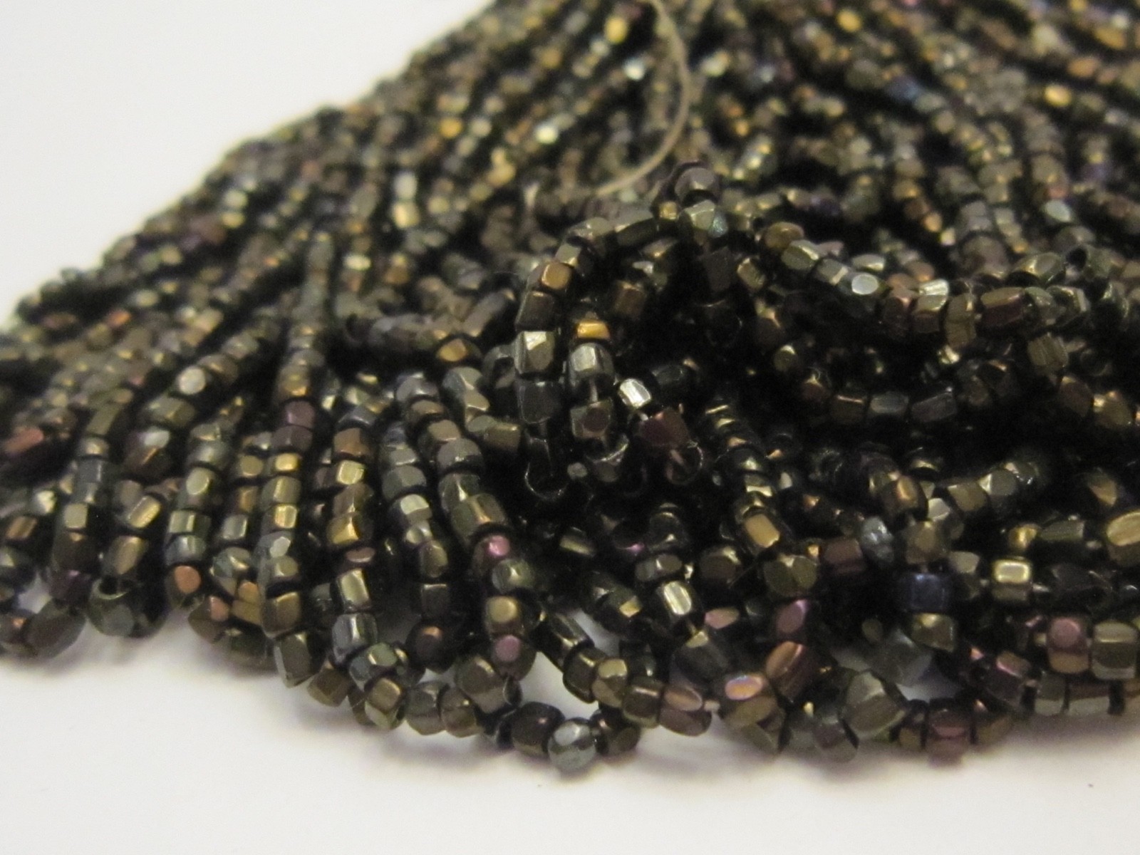Hank Czech vintage dark topaz lustre faceted micro seed glass beads