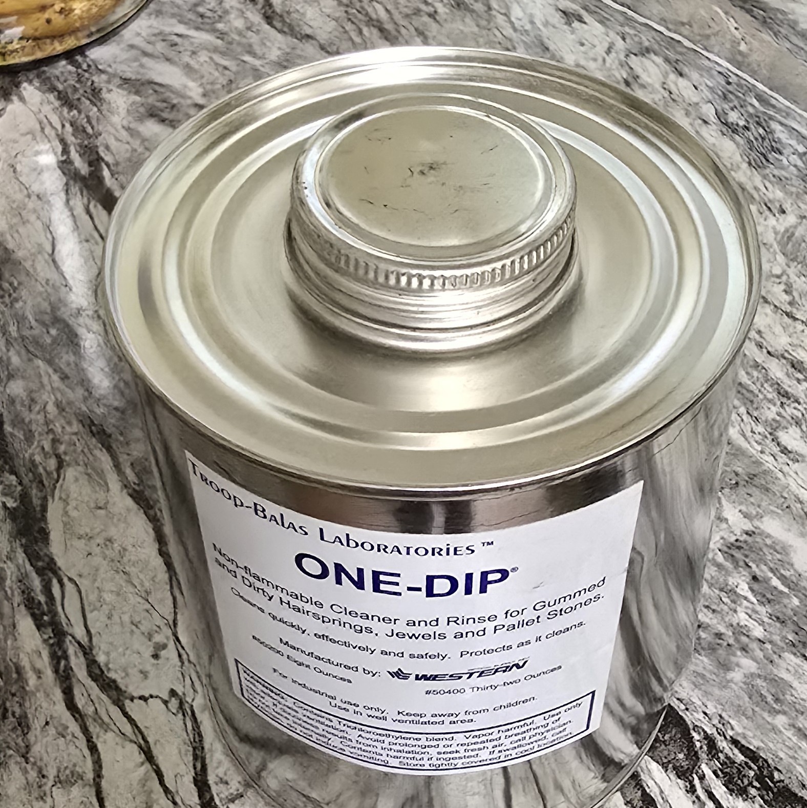 USA Made ONE-DIP cleaning solution for hairsprings and watch parts.