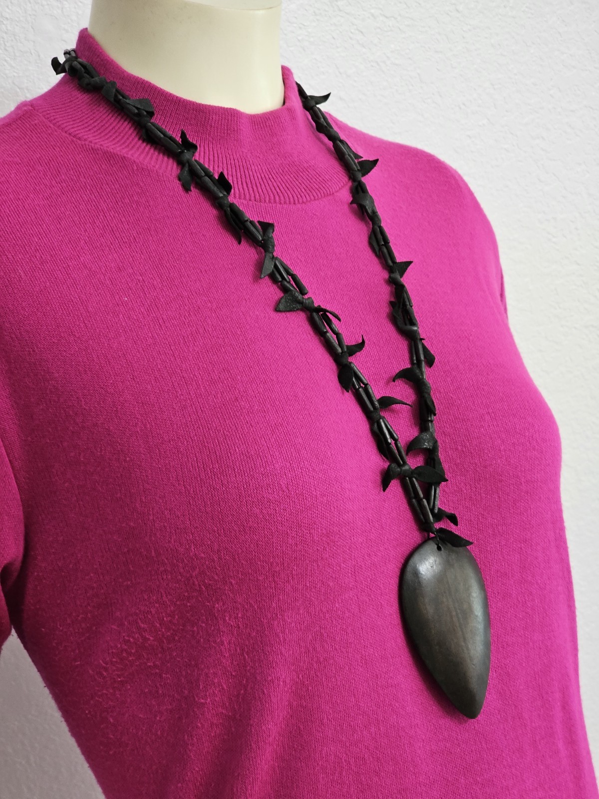 Rare long necklace wood and leather very light weight material. Monies maybe??