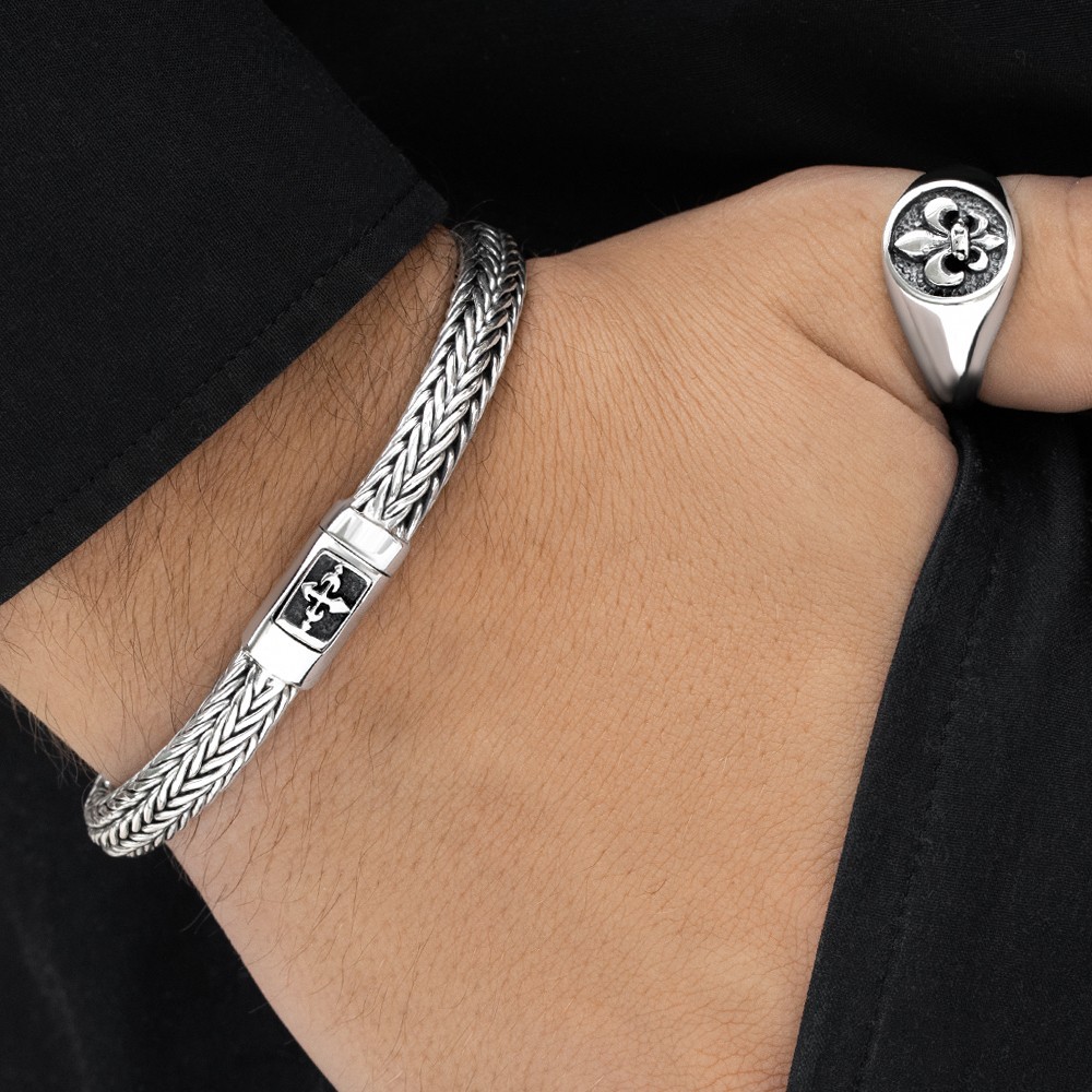 Sleek silver cross bracelet blending faith and modern style for everyday wear.