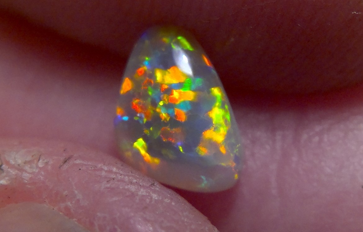 0.89cts Solid Lightning Ridge semi-black opal, extremely bright top gem + video