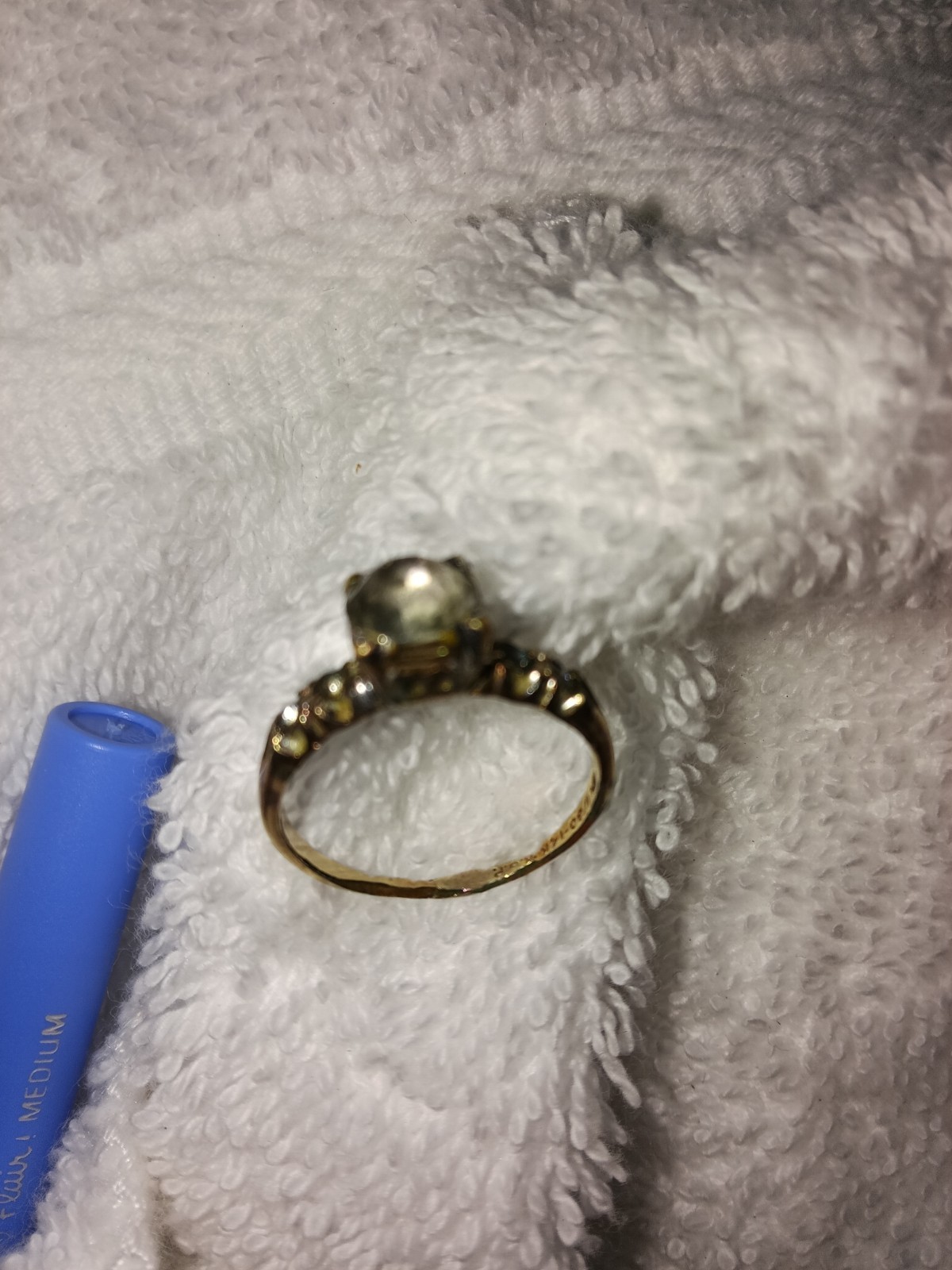 vintage 14k white gold engagement ring a central diamond and side accents.