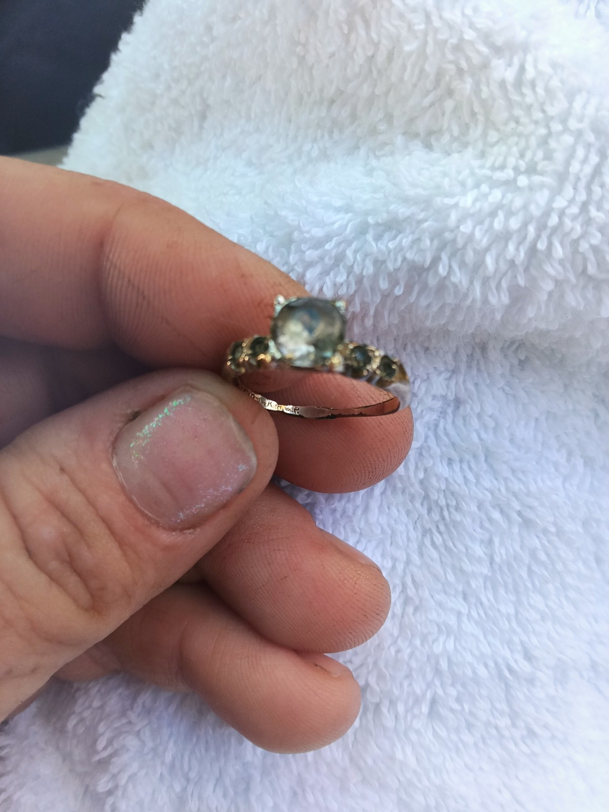 vintage 14k white gold engagement ring a central diamond and side accents.