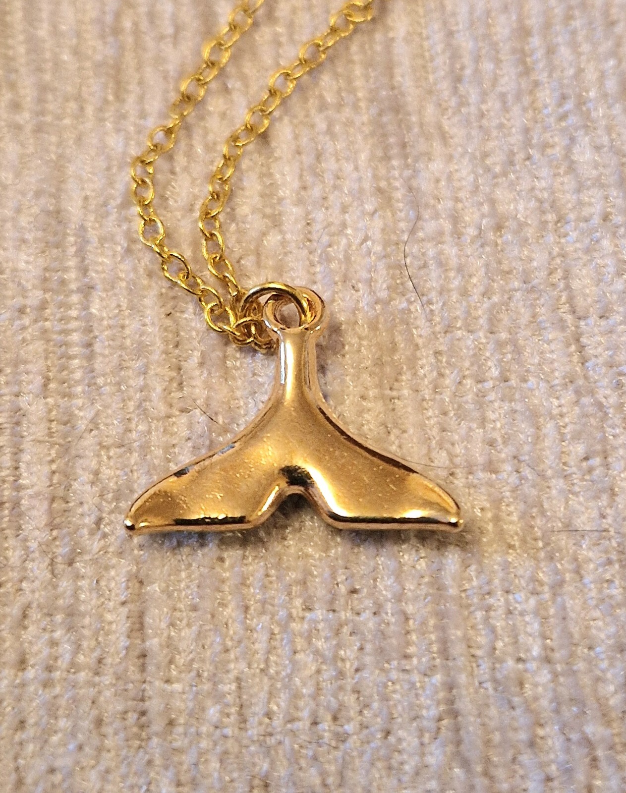 Pretty blue whales tail charm necklace on 16 inch gold plated chain, good luck
