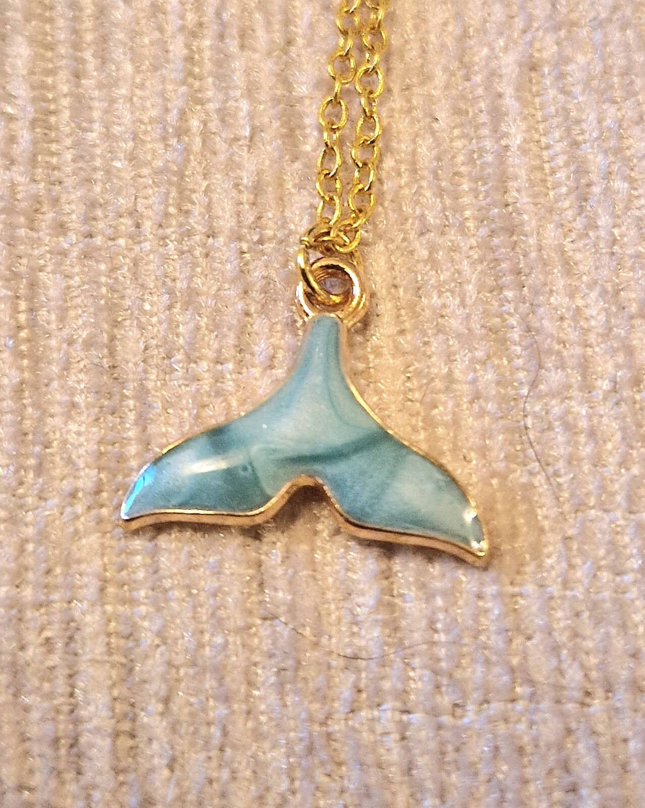 Pretty blue whales tail charm necklace on 16 inch gold plated chain, good luck
