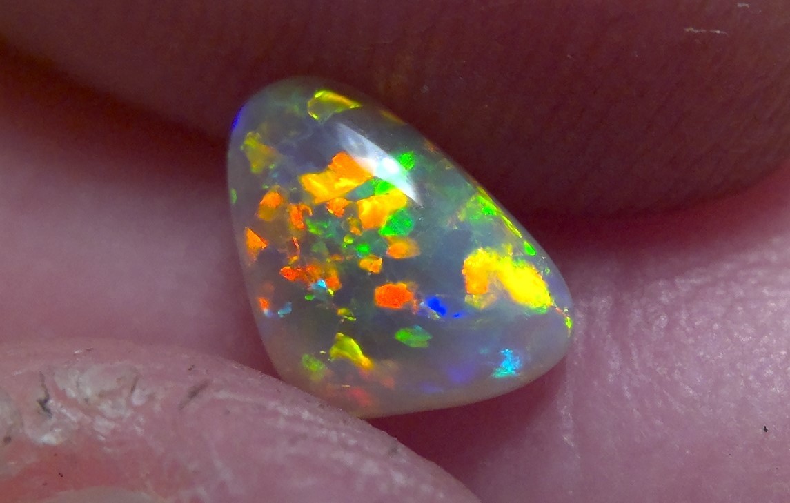 0.89cts Solid Lightning Ridge semi-black opal, extremely bright top gem + video