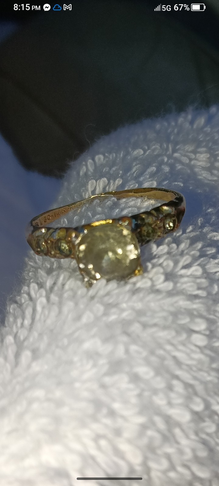 vintage 14k white gold engagement ring a central diamond and side accents.