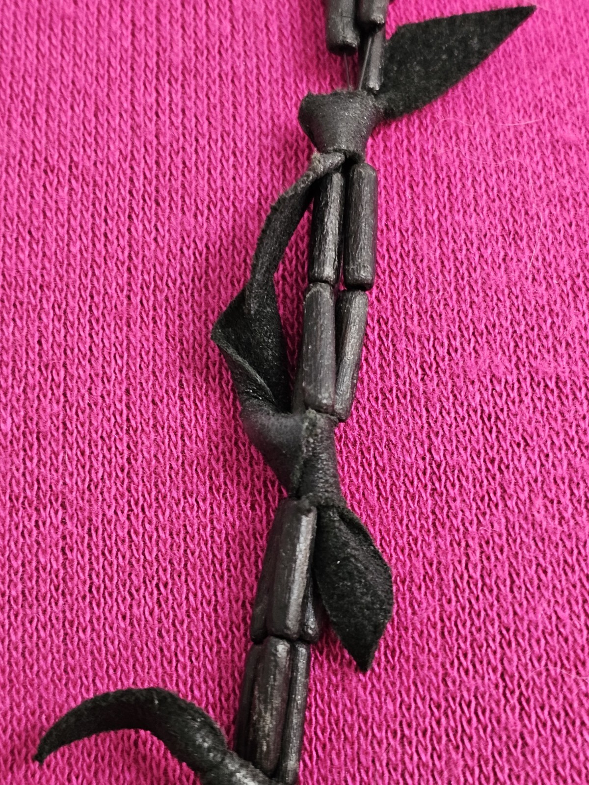 Rare long necklace wood and leather very light weight material. Monies maybe??