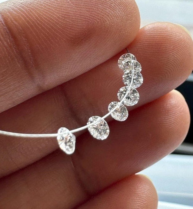 0.60tcw 6pcs EF Color Drilled Round Cut Lab Grown Diamond for Jewelry Creation.