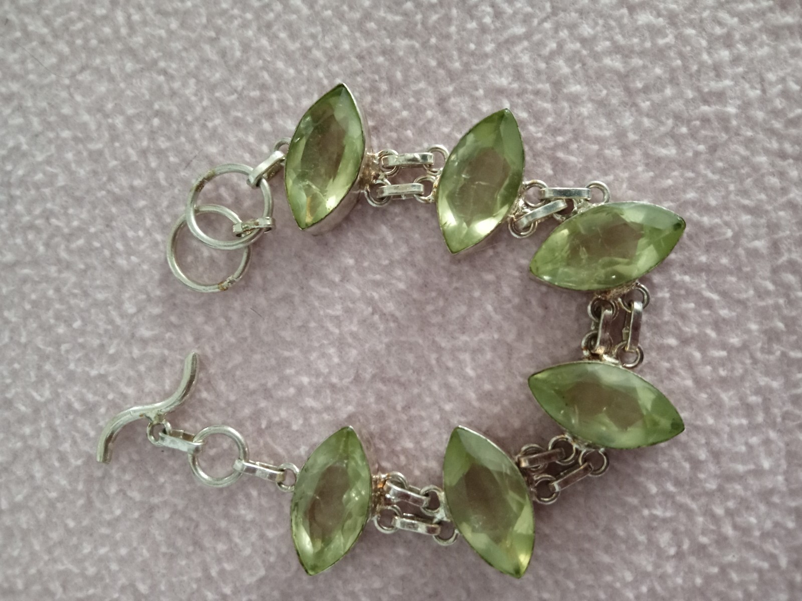 7 inch Bracelet with 5 faceted pale green stones set in silver