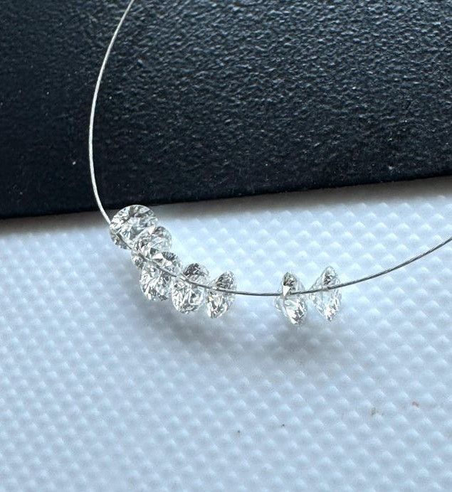 0.60tcw 6pcs EF Color Drilled Round Cut Lab Grown Diamond for Jewelry Creation.