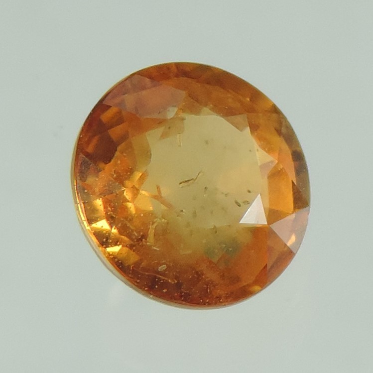 orange sapphire faceted round cut, sri lanka, 0.9 cts #83