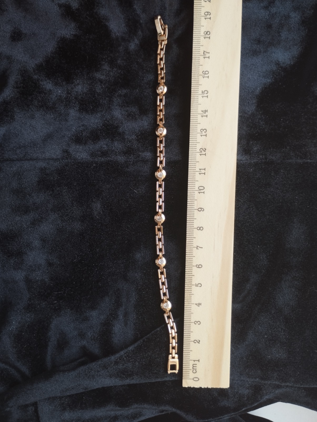 Gold-colored bracelet.