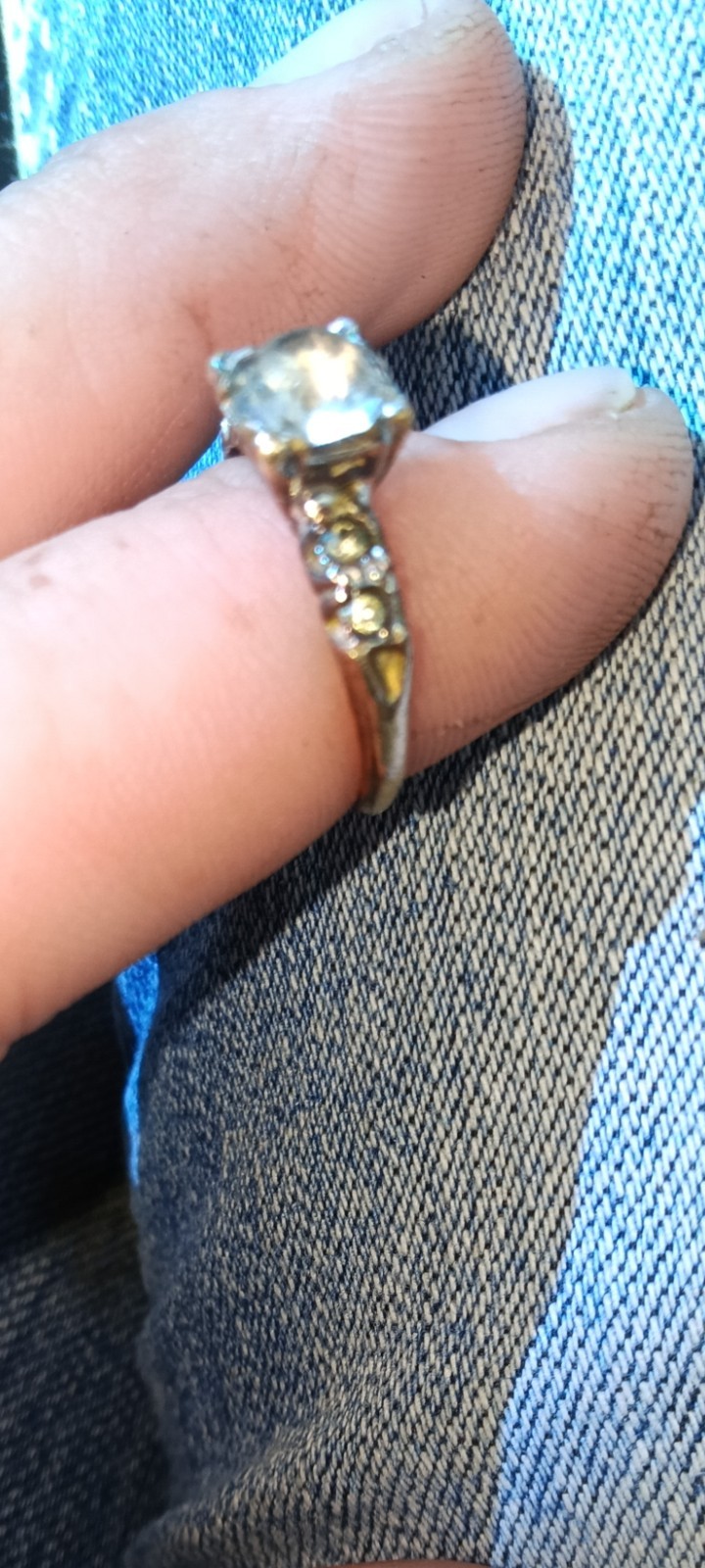 vintage 14k white gold engagement ring a central diamond and side accents.
