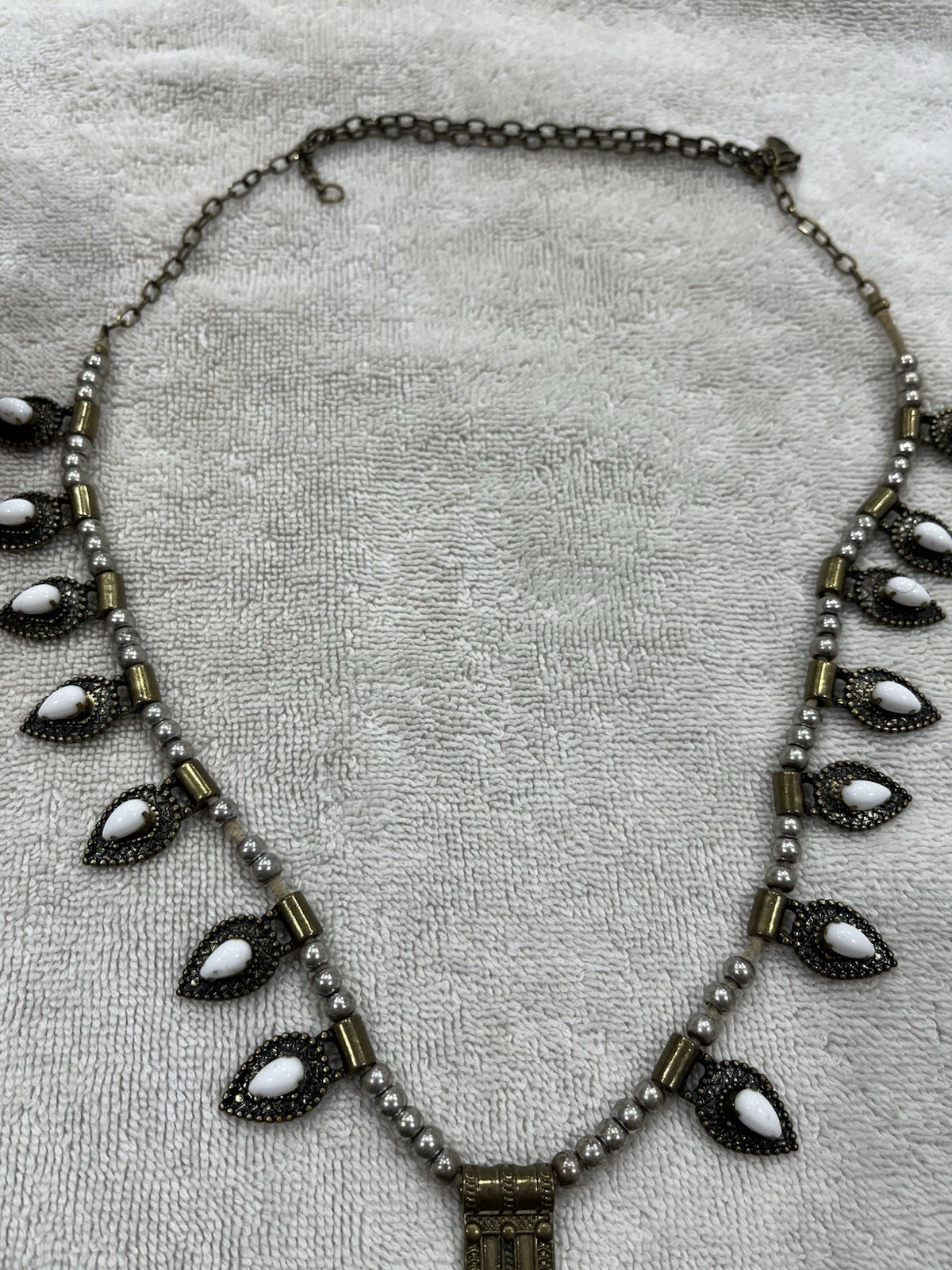 This Stella & Dot Eclipse necklace features white opalescent stones