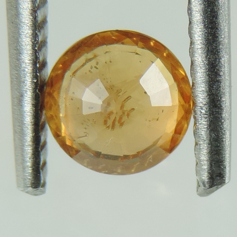 orange sapphire faceted round cut, sri lanka, 0.9 cts #83