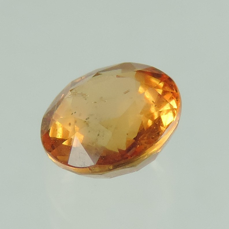 orange sapphire faceted round cut, sri lanka, 0.9 cts #83