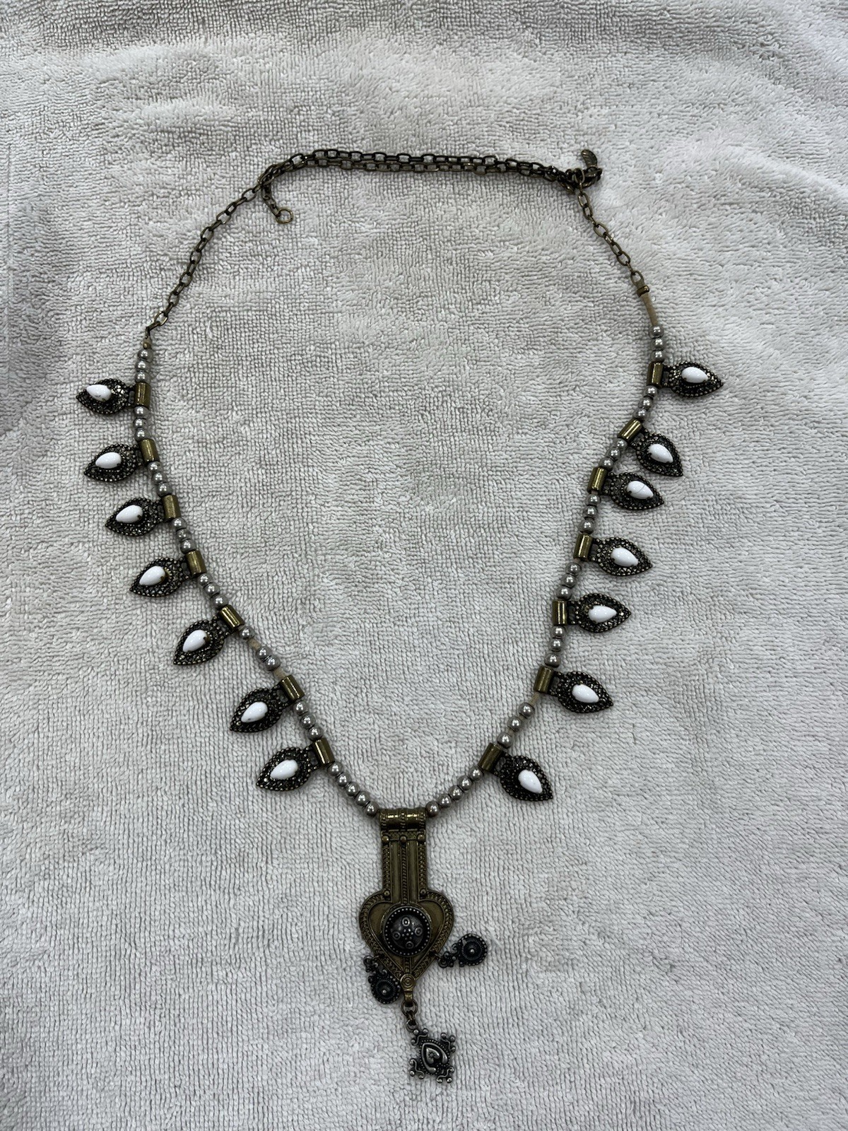 This Stella & Dot Eclipse necklace features white opalescent stones