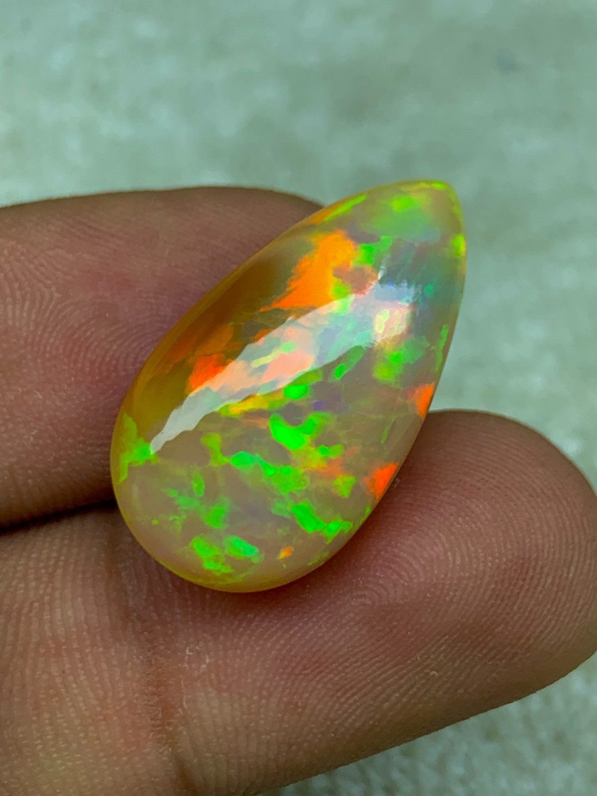 Natural Ethiopian Opal Honeycomb Pattern 14.90 Carat Multi-Fire Pear Cabochon