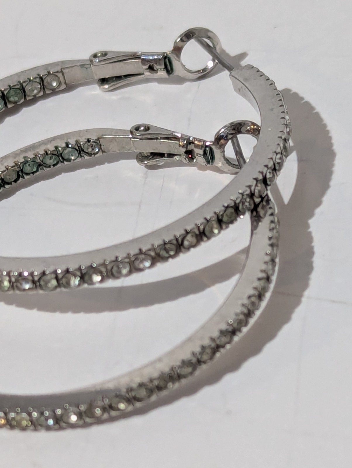Touchstone Crystal by Swarovski Silver Tone Inside-Out Clear Pavé Hoop Earrings