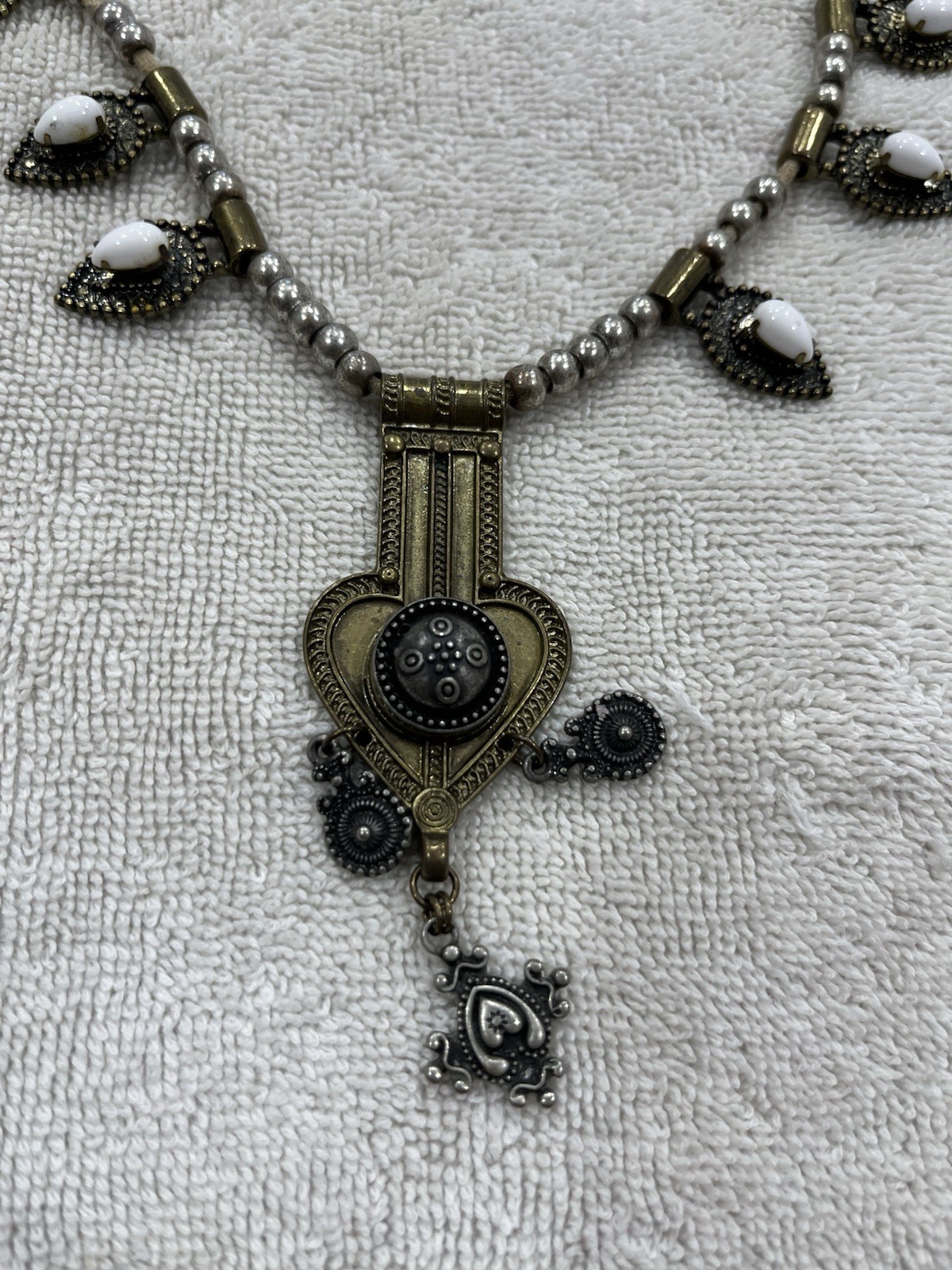 This Stella & Dot Eclipse necklace features white opalescent stones
