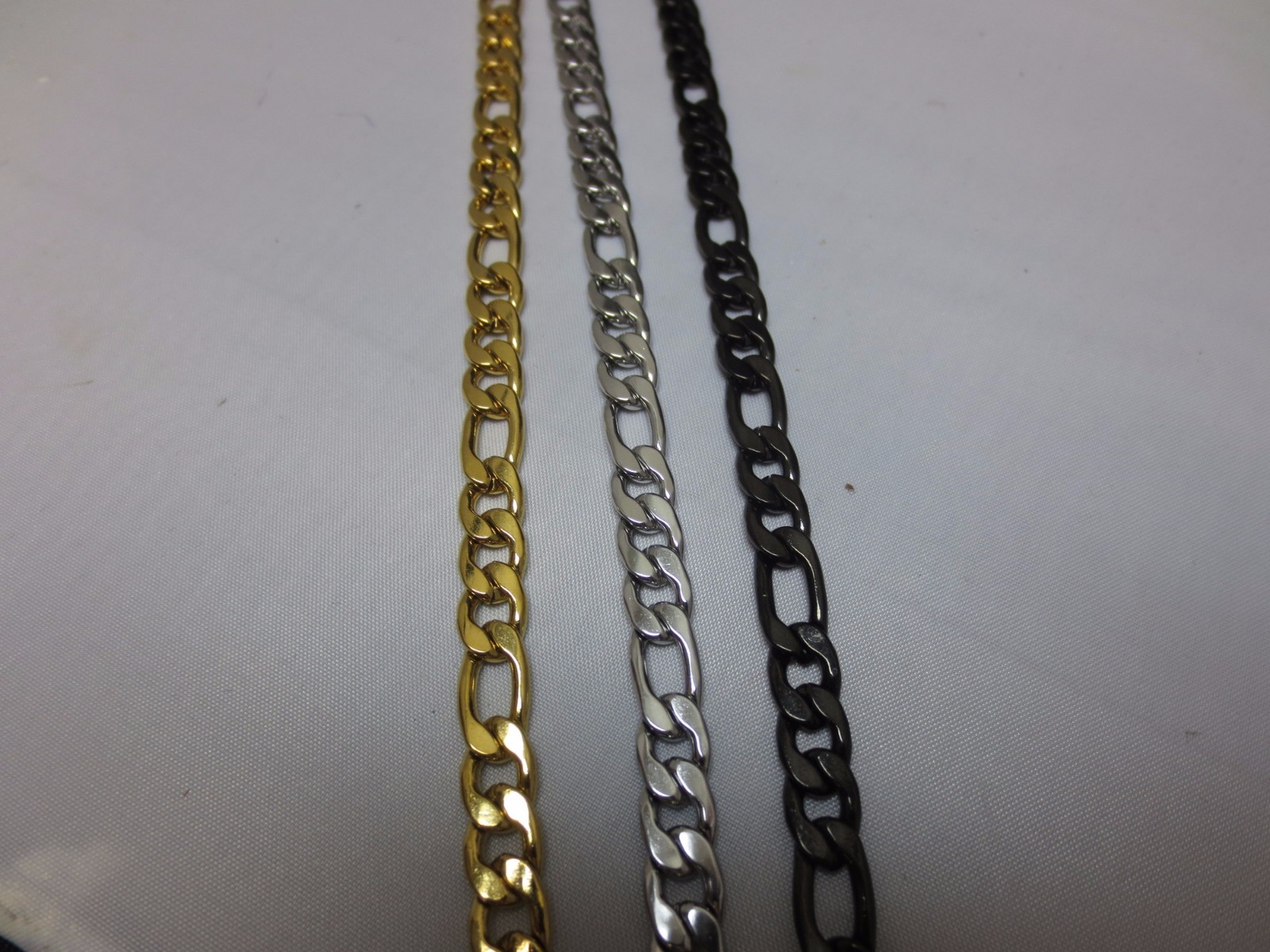 7MM STAINLESS STEEL FIGARO ROPE IN GOLD-SILVER-BLACK-PLATED 7 “-40” CHAIN