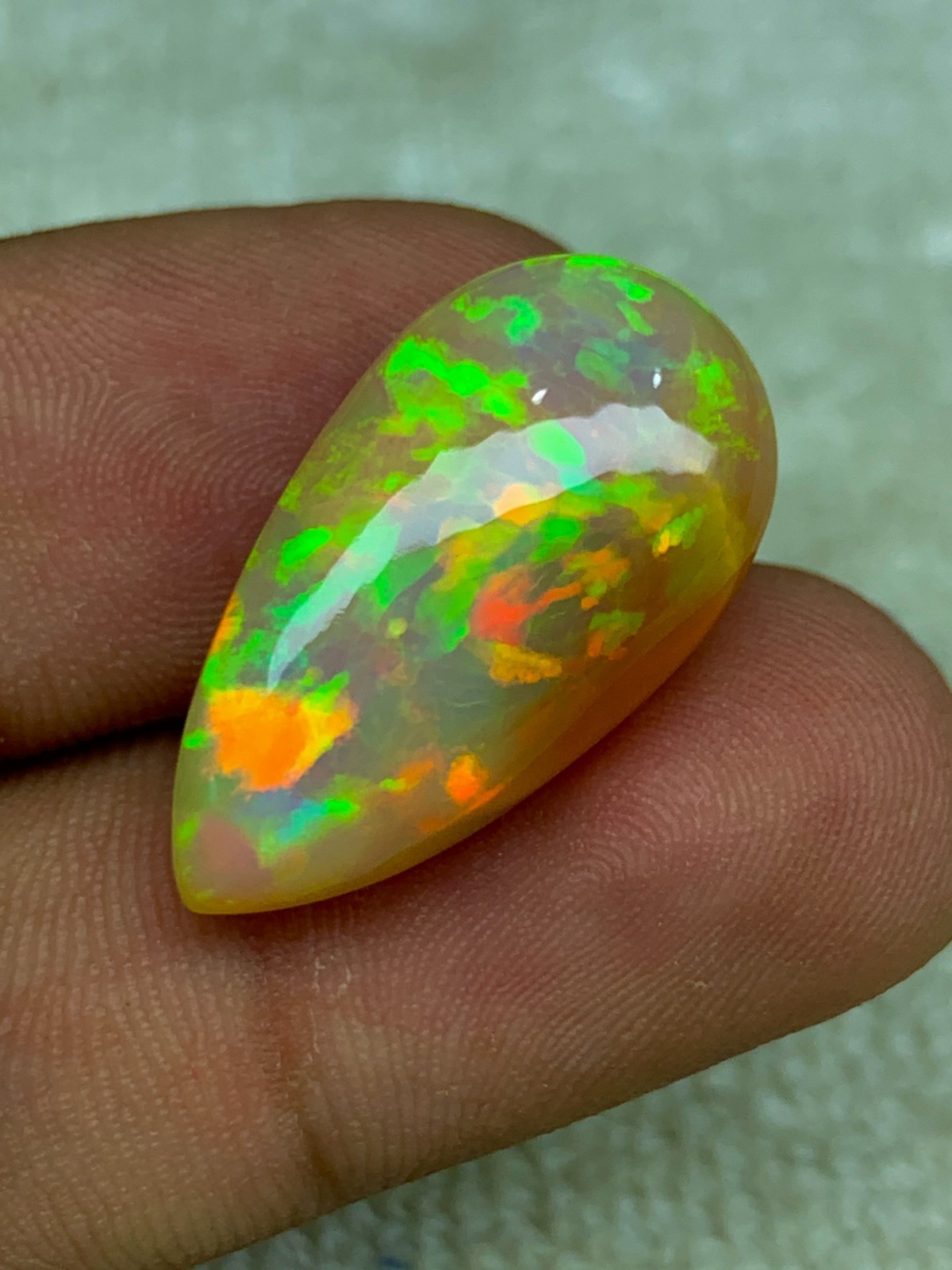 Natural Ethiopian Opal Honeycomb Pattern 14.90 Carat Multi-Fire Pear Cabochon