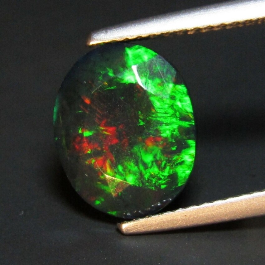 ETHIOPIAN BLACK OPAL FACETED 7 x 5 MM OVAL CUT ALL NATURAL F-4698