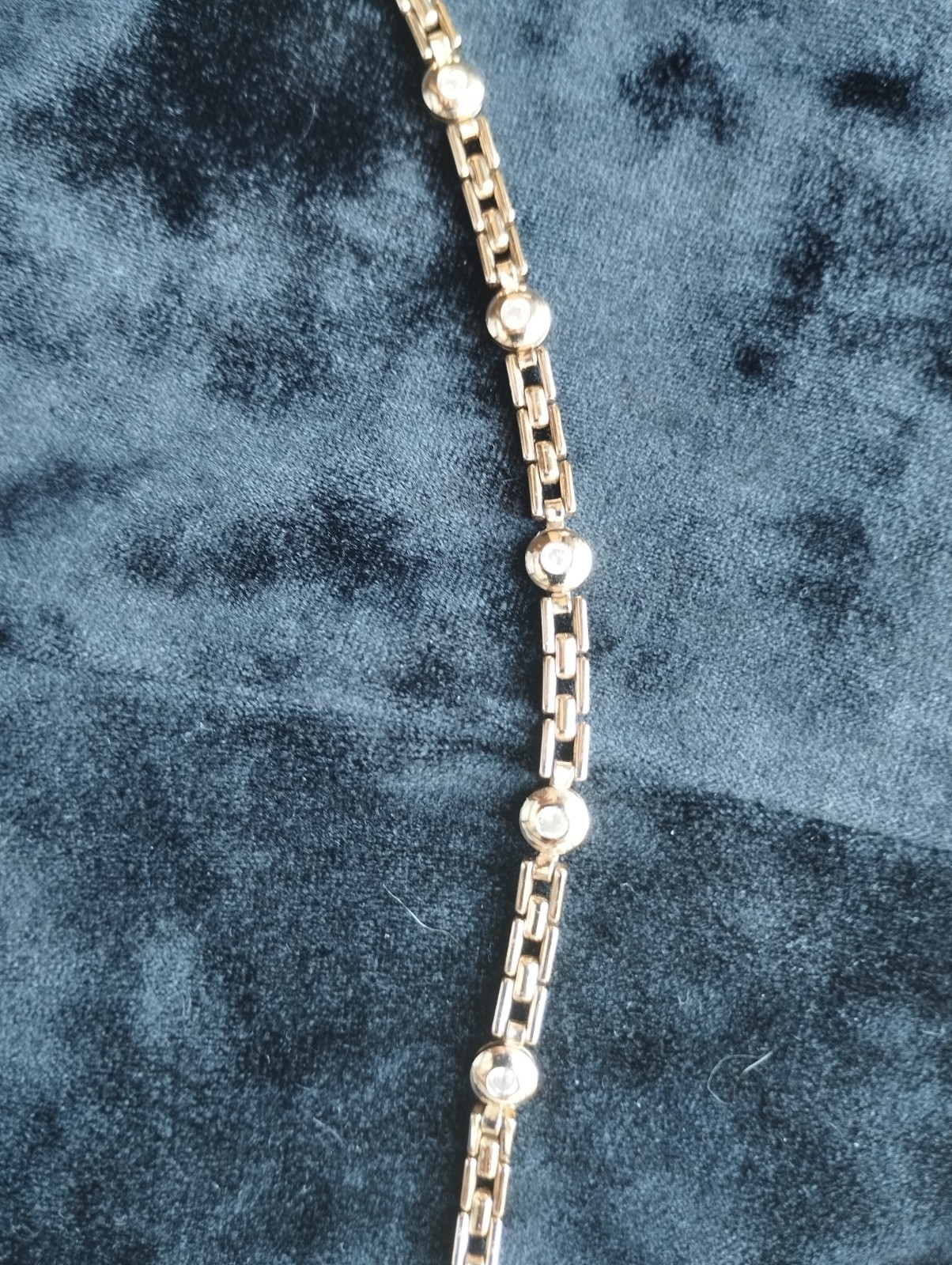 Gold-colored bracelet.